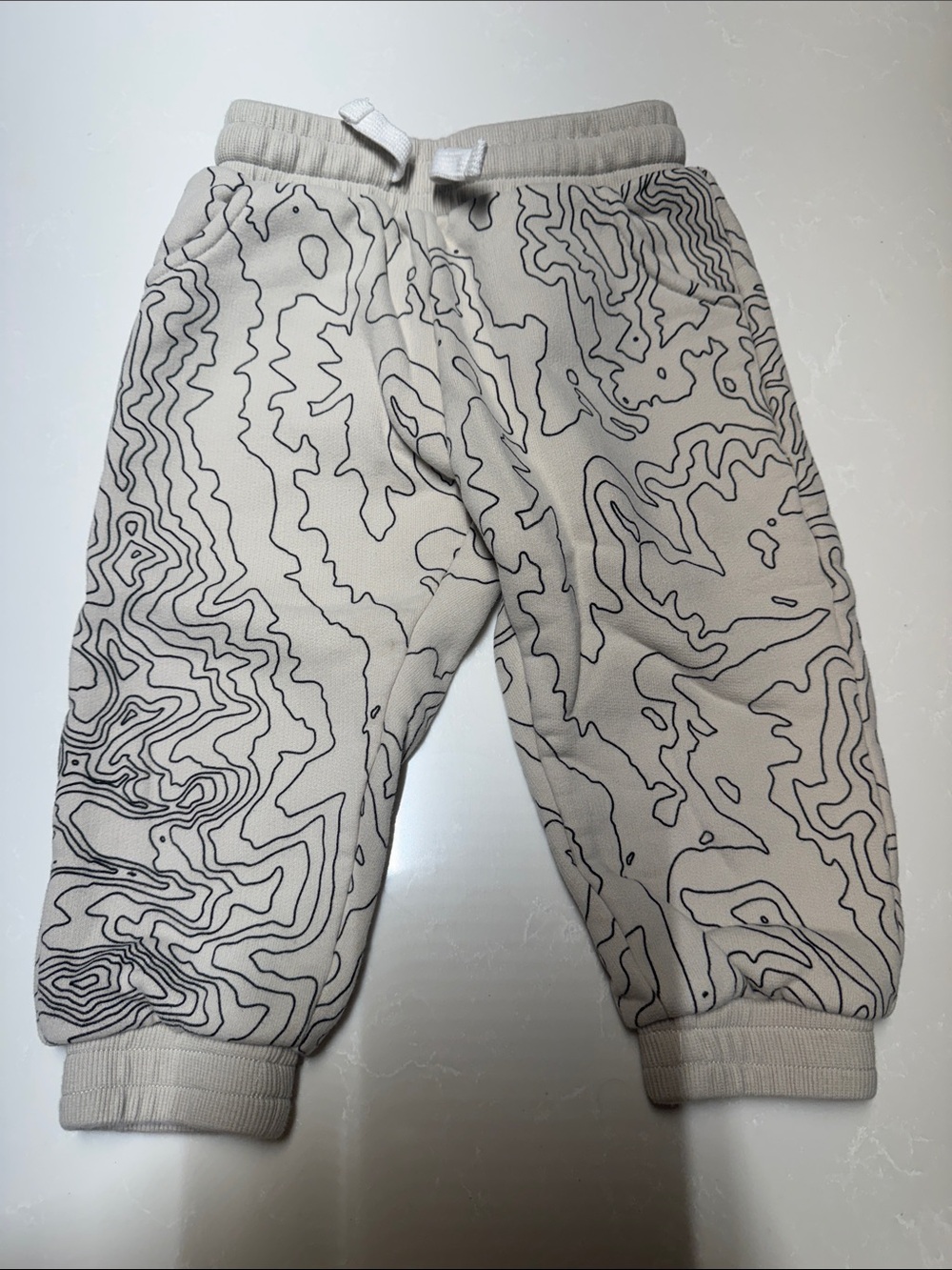 Little Bipsy Cream Jogger Pants with Black Contour Pattern